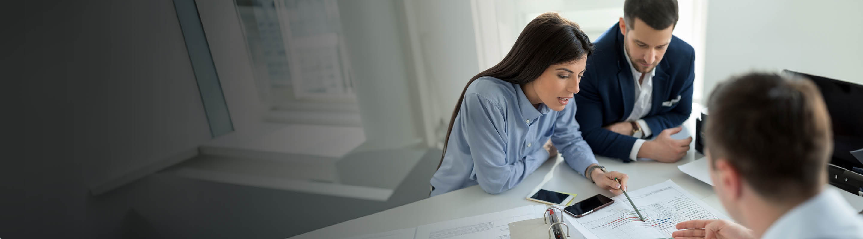 three people in an office